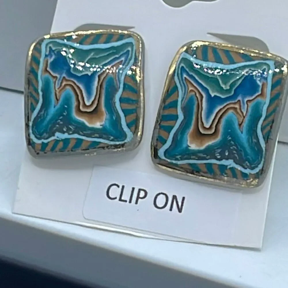 Vintage metal enamel clip style earrings.